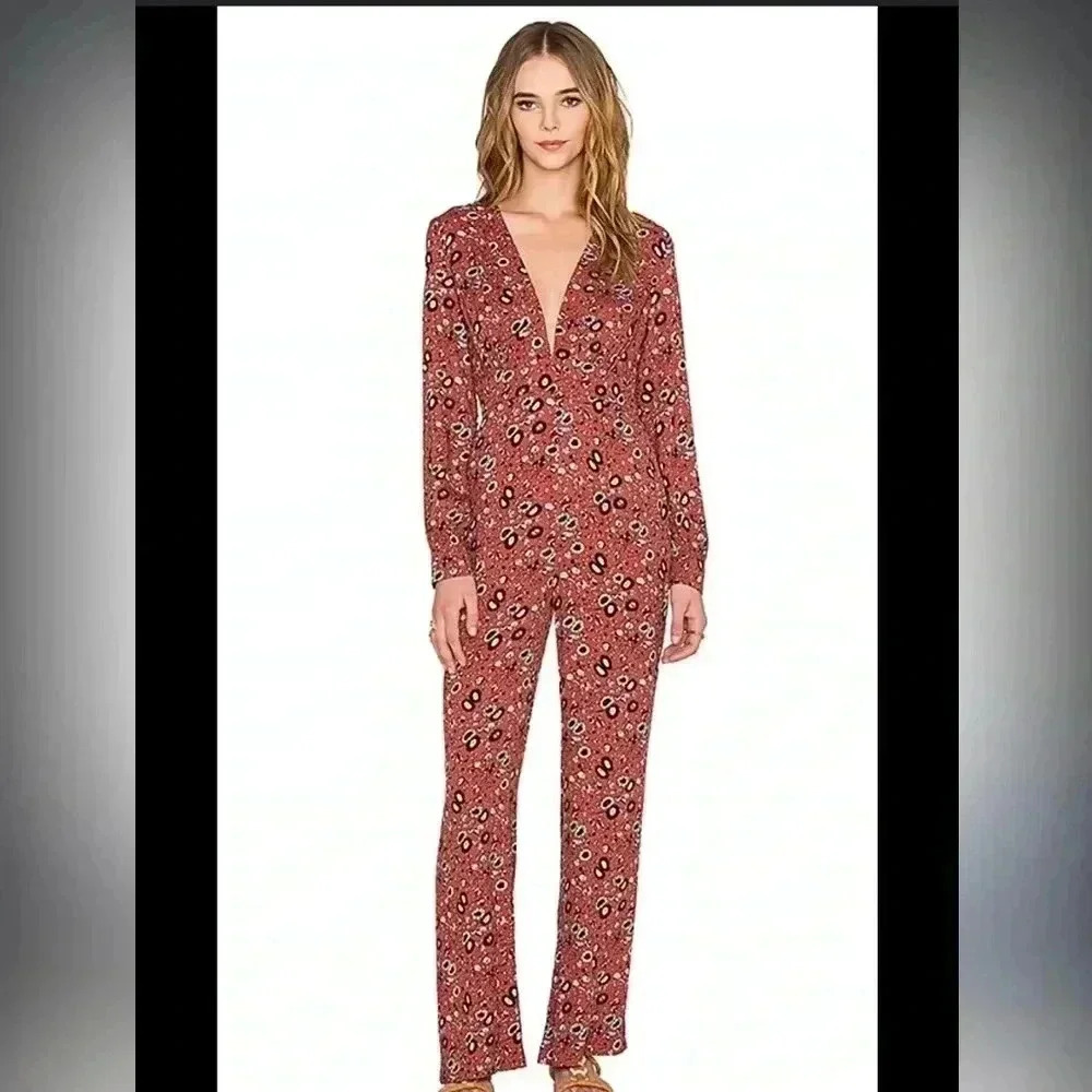 Free People Some Like it Hot Jumpsuit in Rust Combo
Size 4